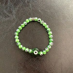Green stretchy evil eye bracelet